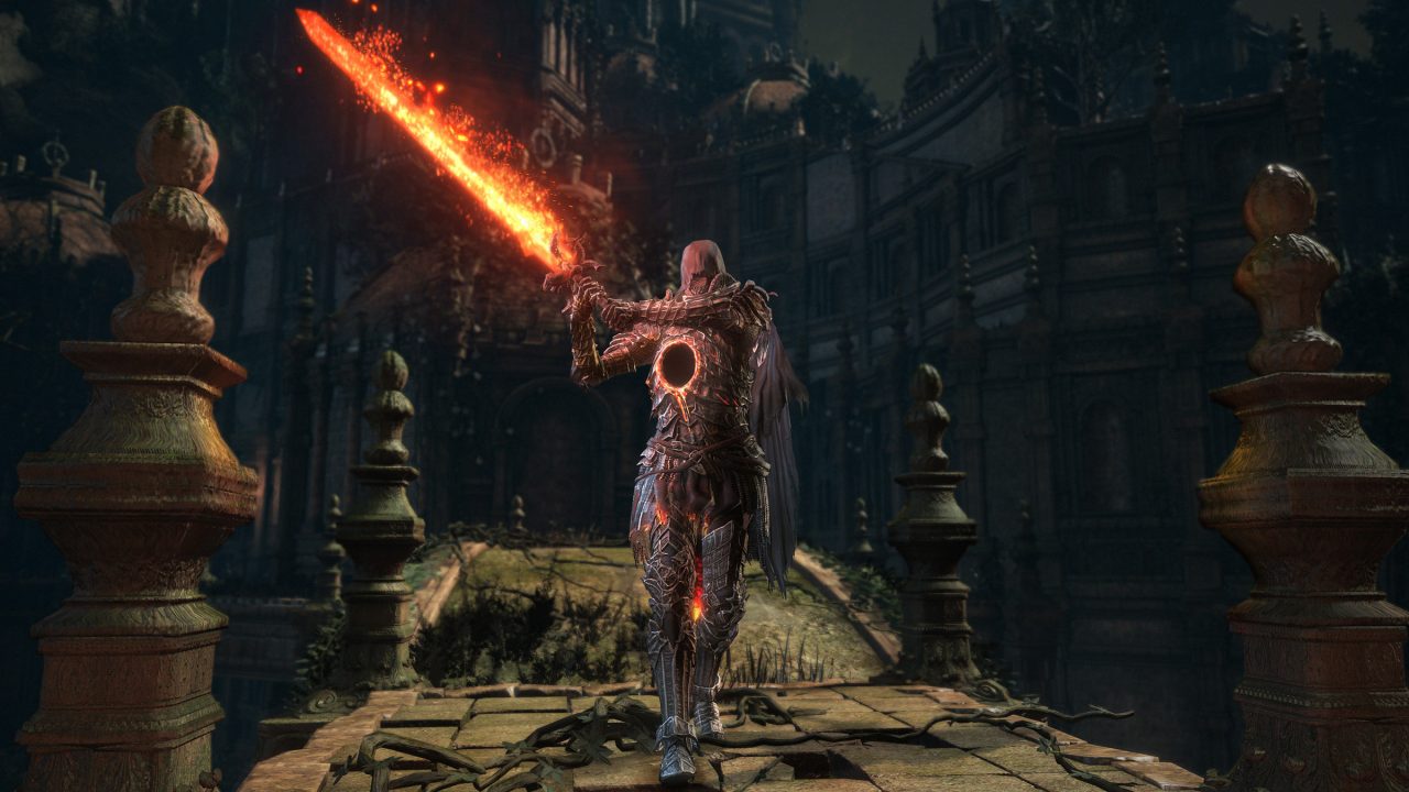 A screenshot of a man holding a flaming sword in Dark Souls 3