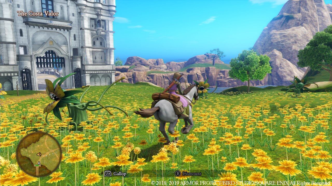 Hero in a purple tunic rides a gray horse through a field of yellow flowers near a castle in dragon quest 11.