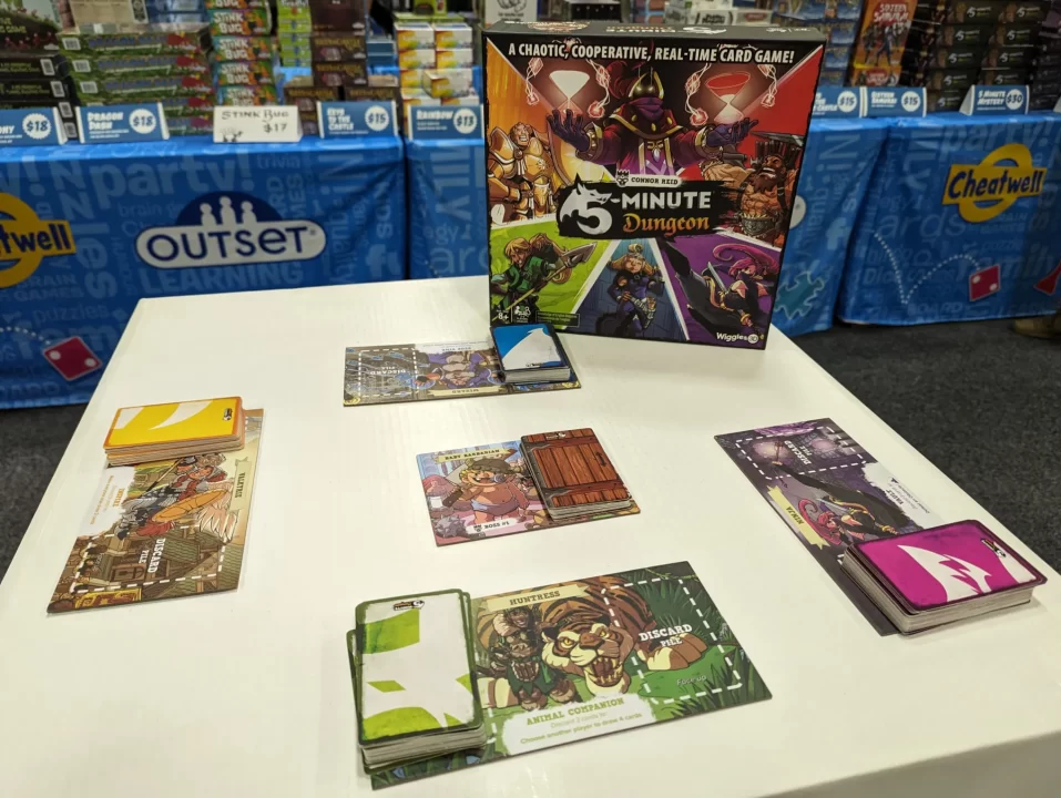 5-Minute Dungeon box and game setup on a table at Origins 2024.