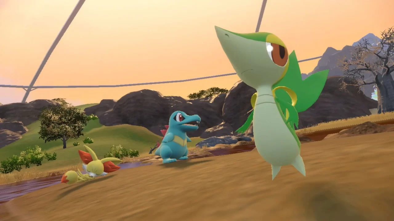 Fennekin, Totodile, and Snivy having some leisure time by the riverbank in The Indigo Disk.